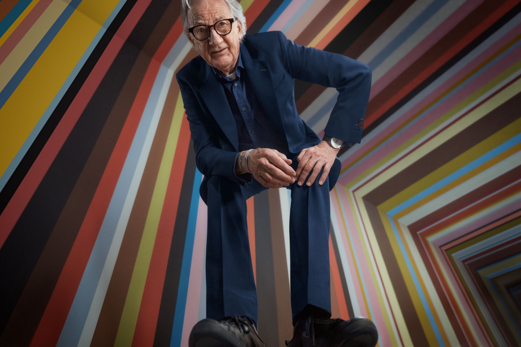 Paul Smith's profile picture posing against a striped background